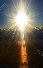 Shining sun above stormy clouds. Day & night.