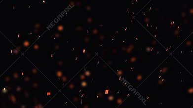 Ultra slow motion shot of fire flames and glowing ashes on black background