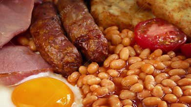 Cooked Breakfast With Sausages, Egg, Beans, Bacon And Hash Browns
