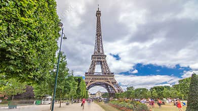 Champ de Mars and the Eiffel Tower timelapse hyperlapse in a sunny summer day. Paris, France