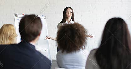 Asian Businesswoman Speaker On Presentation With Group Of Business People Asking Questions During Conference Meeting