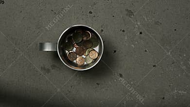 Poverty concept with tin mug