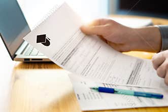 Man reading college or university application or document.
