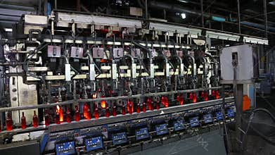 Manufacturing process of bottles in glass factory.