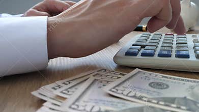 Man using calculator for budgeting. Wealth and Savings.