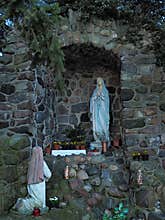 Statue of Our Lady and St Bernadette in grotto