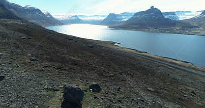 Flying out over beautiful fjord in Iceland