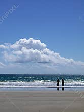 Beach: two men friends fishing