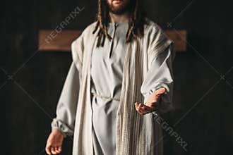 Man in the image of Christ reaching out his hand
