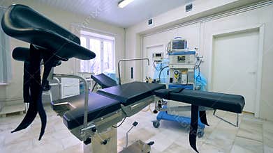 Empty examination chair in a gynecological hospital room