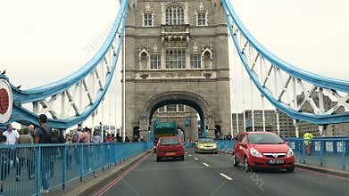 London, United Kingdom - August 24, 2017: Driving through traffic on Tower Bridge iconic symbol of London