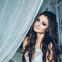 Beautiful Woman with Wedding Hair and Perfect Makeup