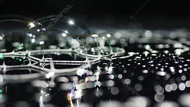 Soap bubbles on dark background