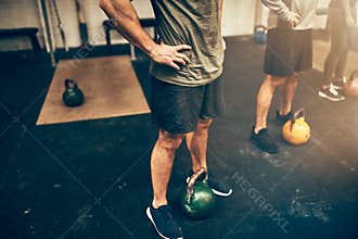 Fit people preparing to workout with weights at the gym