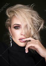 Beautiful Blond Girl. Long Hair. Blonde isolated on Black Background.