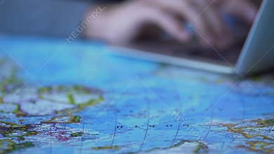 Man typing e-mail on laptop, sharing impressions from car trip in social media