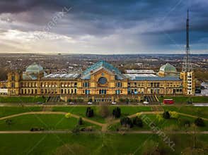 London, England - Aerial panromaic view of Alexandra Palace in Alexandra Park with iconic red double-decker bus