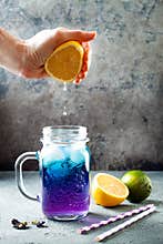 Butterfly pea flower blue iced tea or lemonade. Healthy detox herbal drink.