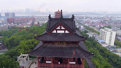 WUHAN, CHINA - MAY 2, 2017: red gate bell temple park day yellow crane aerial drone view panorama