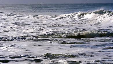 Waves breaking near shore