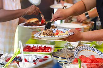People at a Summer Potluck Barbecue