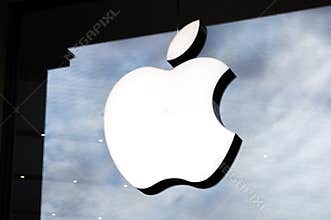 Logo of Apple Inc. on a Apple store. Apple is the multinational technology company headquartered in Cupertino, California.