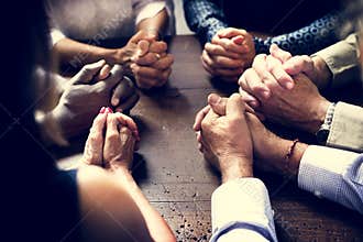 Diverse Group Of Christian People Praying Together