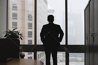 Silhouette of thinking businessman