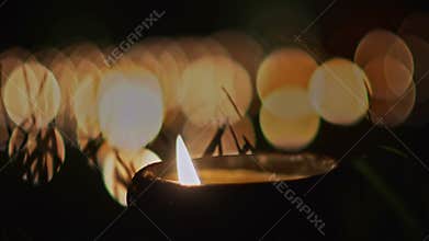 Candles on pond in religion ceremony