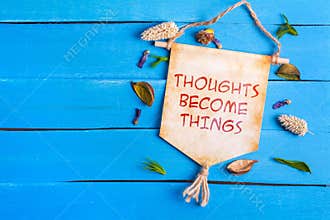 Thoughts become things text on Paper Scroll