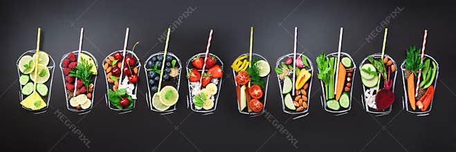 Food ingredients for blending smoothie or juice on painted glass over black chalkboard. Top view with copy space