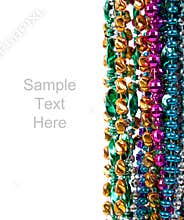 Mardi gras beads on white with copy space