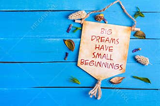 Big dreams have small beginnings text on Paper Scroll