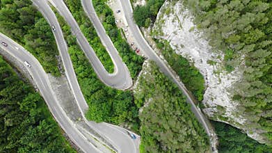 Curved road with cars and beautiful forest landscape. Bicaz gorges, Romania.