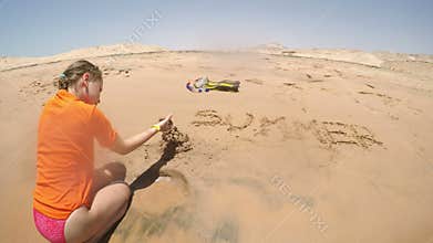 Little girl creating sand castle