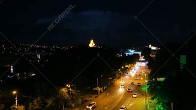 Cars relentlessly rushing along avenue of night Tbilisi, Georgia, time-lapse