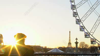 Beautiful sunset in Paris France, tourists watching Big Wheel and Eiffel Tower