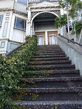 Victorian house entrance, ivy covered stairs
