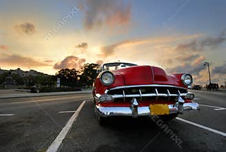 Red car in Havana sunset