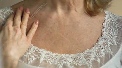 Lady looking at effect of skin-care anti-aging cosmetics, desire to be beautiful