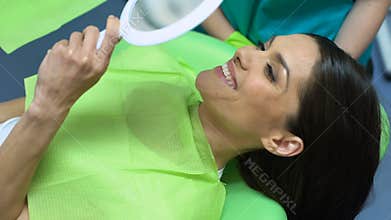 Patient satisfied with dental treatment, professional help, cosmetic dentistry