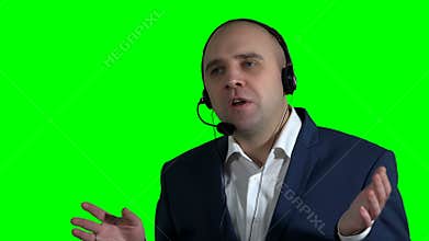 Confident male customer service representative with headset in call center