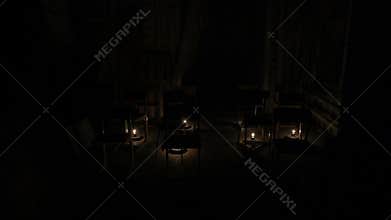 In an empty room lights are lit, chairs on the stage