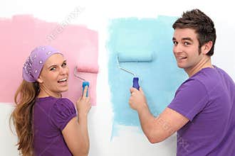 Couple decorating painting