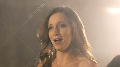 Beautiful opera singer girl. 4k Portrait close up of the artist singer.