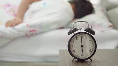 Alarm clock with woman background sleeping