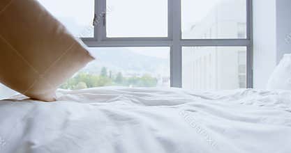 Woman holding pillow in bedroom 4k