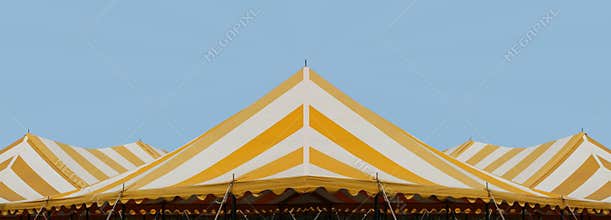 White and yellow stripe events tent