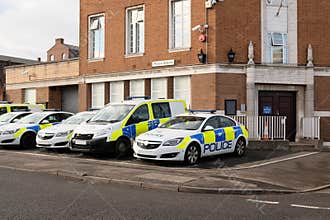 Police vehicles outside the Police station, UK