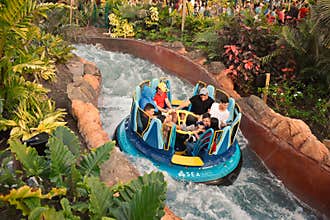 People enjoying ride in Infinity Falls at Seaworld Marine Theme Park.